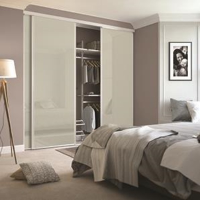 beige sliding wardrobes in a neutral bedroom