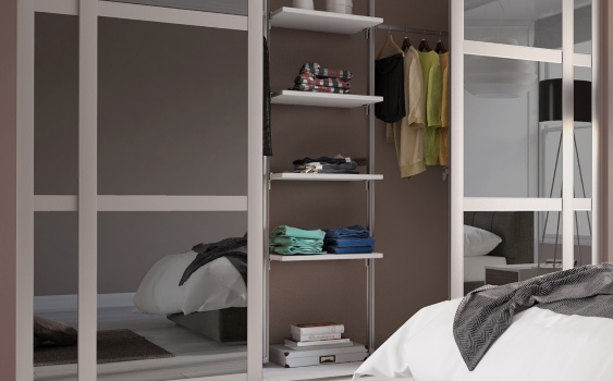 Panelled sliding wardrobe with shelves and rail inside